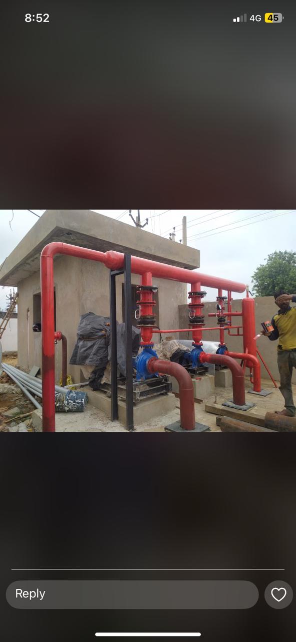 Fire pump house with red pipework and pumps installed by Maroon Peak